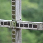 The plaques on the cross are to honor the memory and celebrate the life of campers who attended camp and have gone home to Jesus.